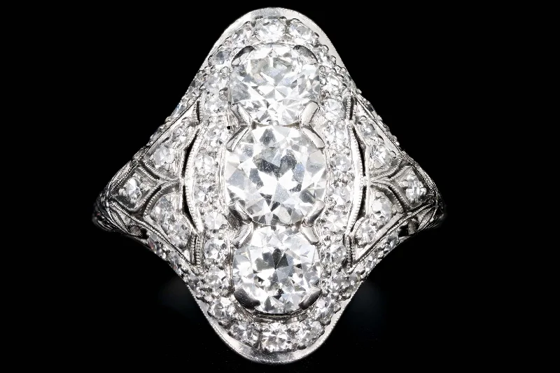 Art Deco Platinum 3.16 Carat Total Weight Old European Diamond Shield Ring