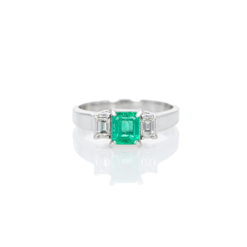 Platinum 0.63 Carat Emerald Diamond Three Stone Ring