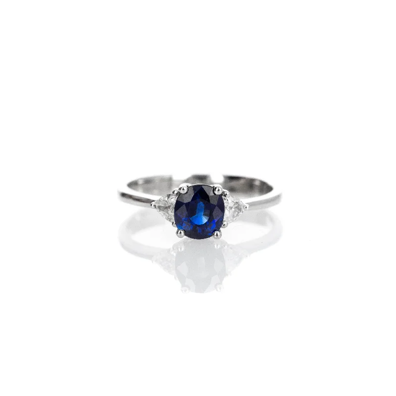 Platinum 0.80 Carat Oval Sapphire Trillion Diamond Three Stone Ring