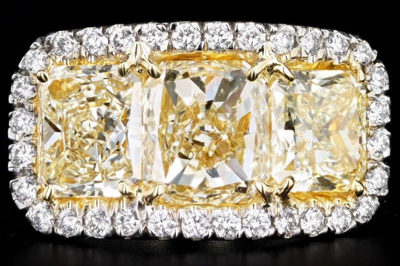 Platinum 5.89 Carat Total Weight Radiant Fancy Light Yellow Diamond Three Stone Ring