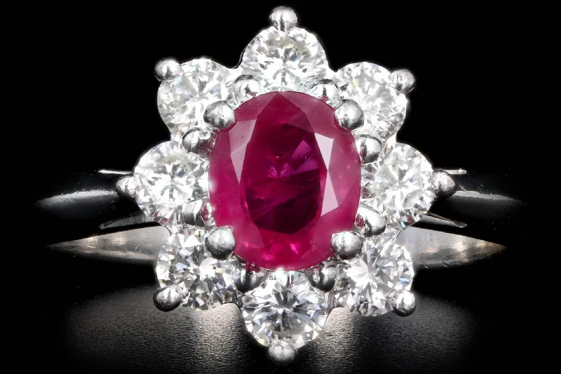 Platinum .72 Carat Oval Natural Ruby & Diamond Halo Ring